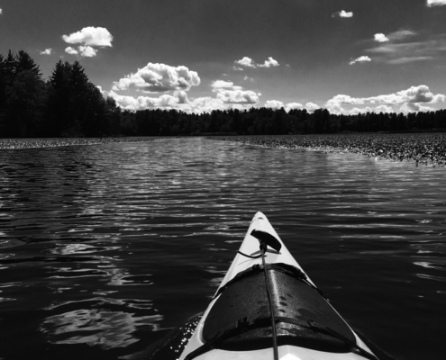 Douglas Patten kayaking on the river